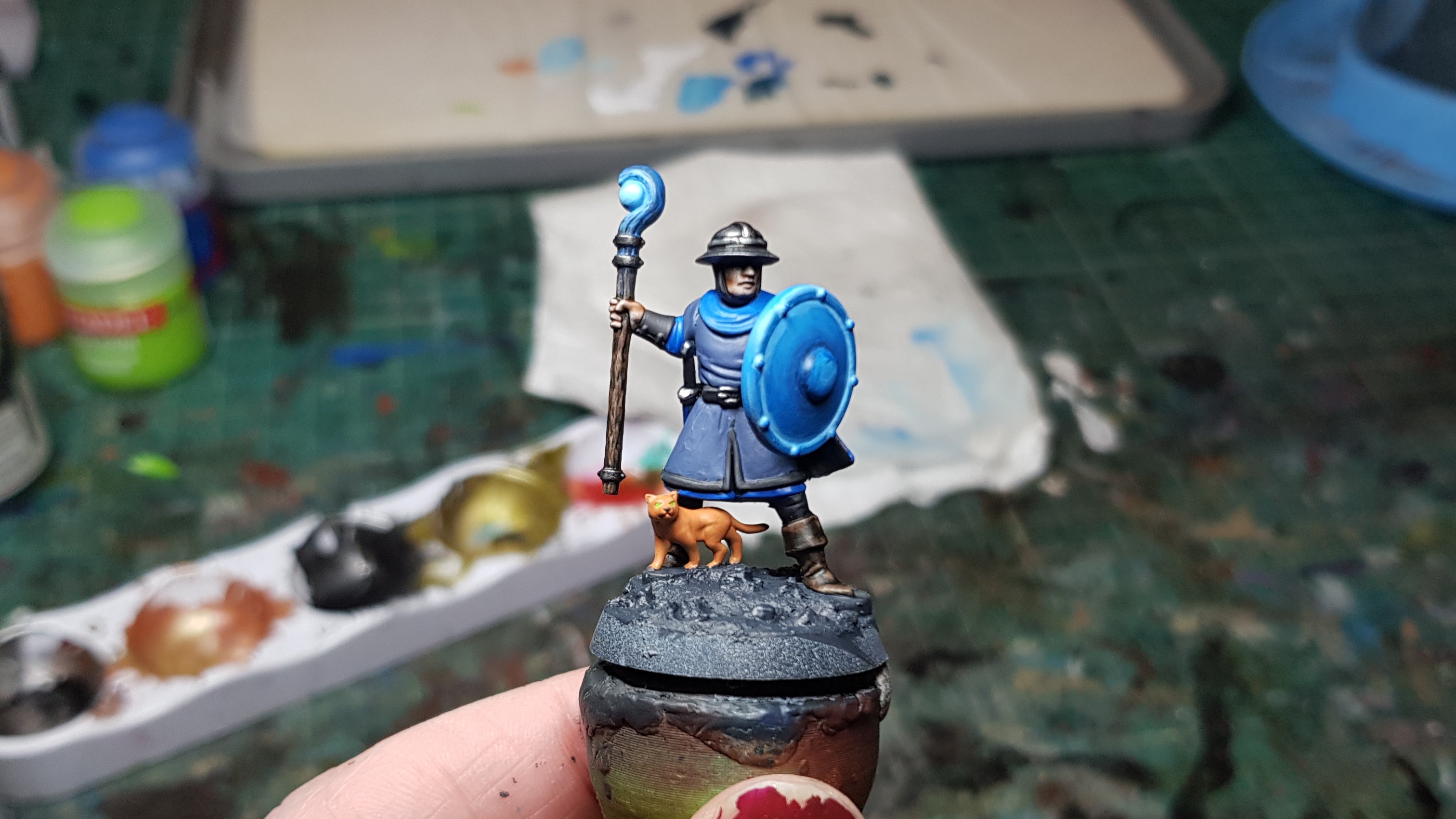 A photo showing a partially-painted Guardian for Magewinds, a mage with a glowy shield.